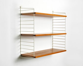 Original 1960s teak Nisse Strinning wall hanging shelf with 3 shelves and two white ladders 30 cm deep