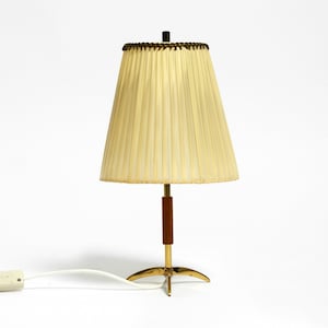 Beautiful small mid century brass star base table lamp from Kalmar with original lampshade