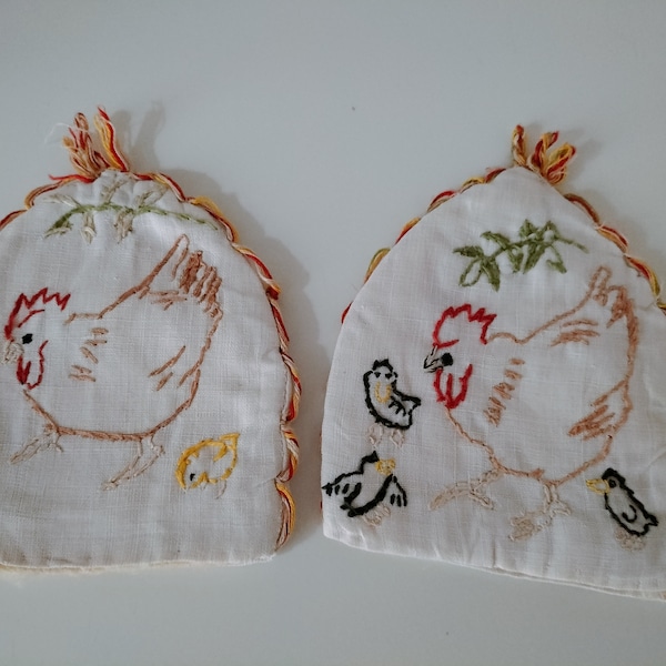 Two old embroidered egg covers