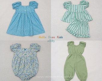 May include: Three different baby girl outfits. The first outfit is a blue dress with a floral pattern. The second outfit is a green and white striped top and shorts set. The third outfit is a green jumpsuit. The text "Hello Dear Kids #R83" is visible in the image.