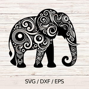 May include: A black and white elephant silhouette with detailed swirling patterns. The design includes decorative elements on the body, head, and trunk. The image includes the text "SVG / DXF / EPS".