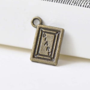 50 unids antiguo bronce diario encantos planos 9x12mm A8473