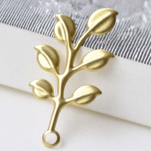 May include: Gold-toned metal leaf branch charm with a loop at the bottom for attaching to jewelry or other crafts.