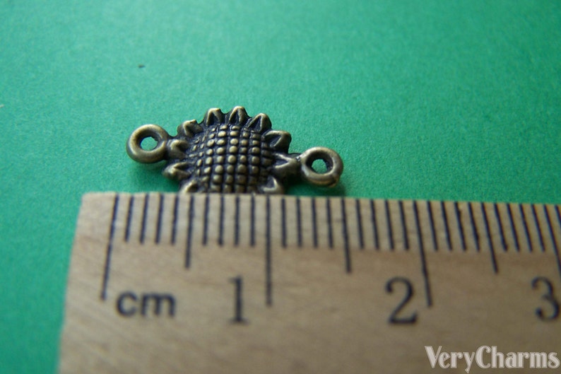 BULK 50 Sunflower Charms Antique Silver Tone Beautiful Detail SC496