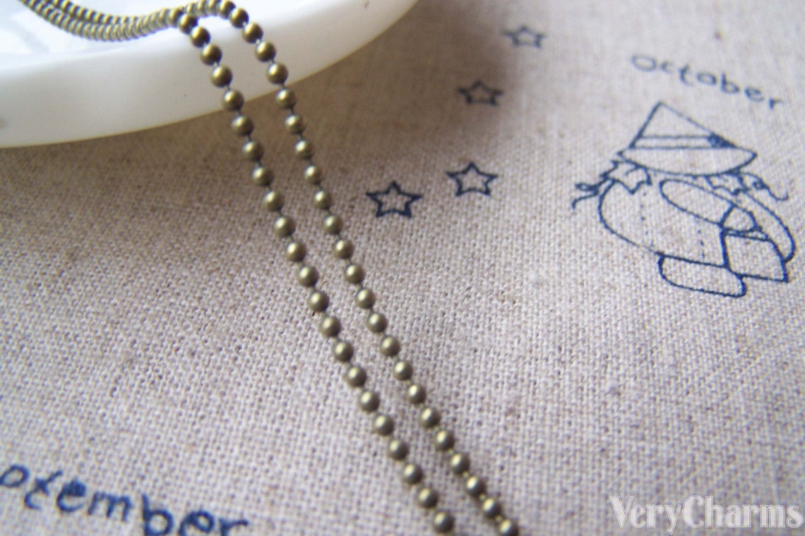 Ball chain vintage coin