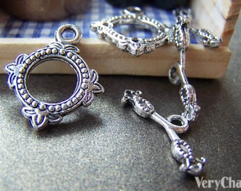 10 set di chiusure a ginocchiera con fiore in argento antico 18x22 mm A2502