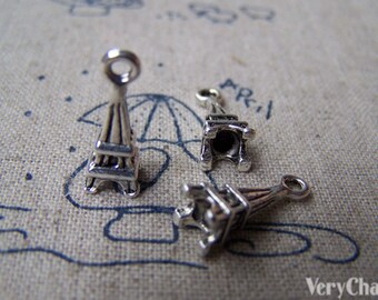 May include: Three silver Eiffel Tower charms with a loop at the top for attaching to jewelry or other crafts.