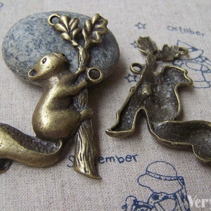 4 pcs of Antique Bronze Squirrel On Tree Trunk Pendants Charms 37x56mm A3356