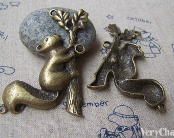 4 pcs of Antique Bronze Squirrel On Tree Trunk Pendants Charms 37x56mm A3356