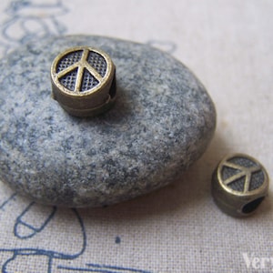 20 pcs of Antique Bronze Peace Symbol Beads 7x10mm A4895