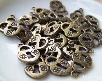 10 pcs of Antique Bronze Flower Lock Charms Double Sided 10x13mm A3005