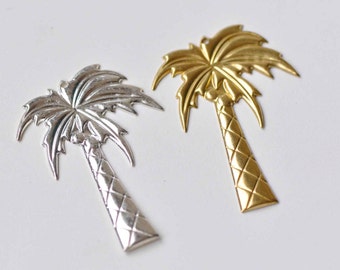 May include: Two palm tree charms, one silver and one gold. The charms are detailed with a textured trunk and leaves.