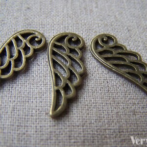 20 pcs of Antique Bronze Filigree Wing Charms 9x23mm A1579