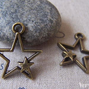 10 pcs of Antique Bronze Filigree Double Star Charms 22x26mm A4365