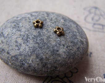 200 pcs of Antique Bronze Tiny Flower Spacer Beads 4.5mm A2791