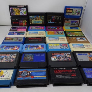 May include: A collection of 24 vintage video game cartridges for the Nintendo Entertainment System (NES). The cartridges are arranged in rows and feature a variety of colorful labels with Japanese text and images.