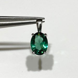 Sterling Silver Oval cut Emerald Pendant.