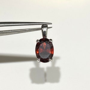 Sterling Silver Oval cut Garnet Pendant.