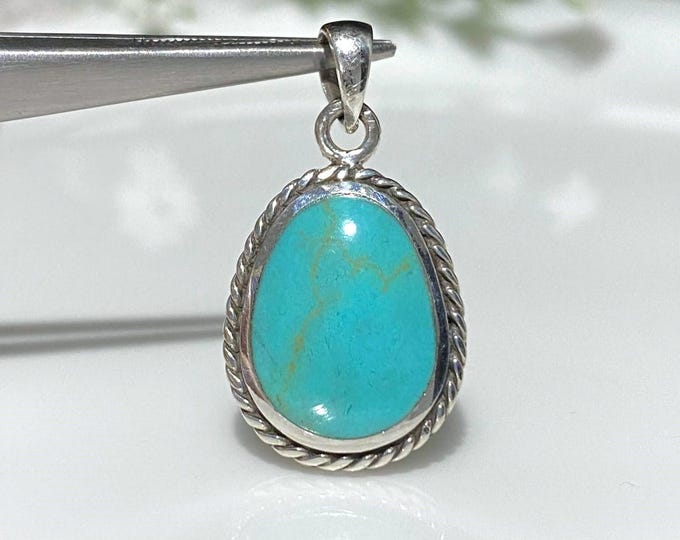 Sterling Silver Turquoise Braided Pendant.