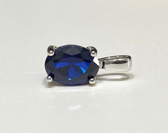 Sterling Silver Oval cut Blue Sapphire Pendant.