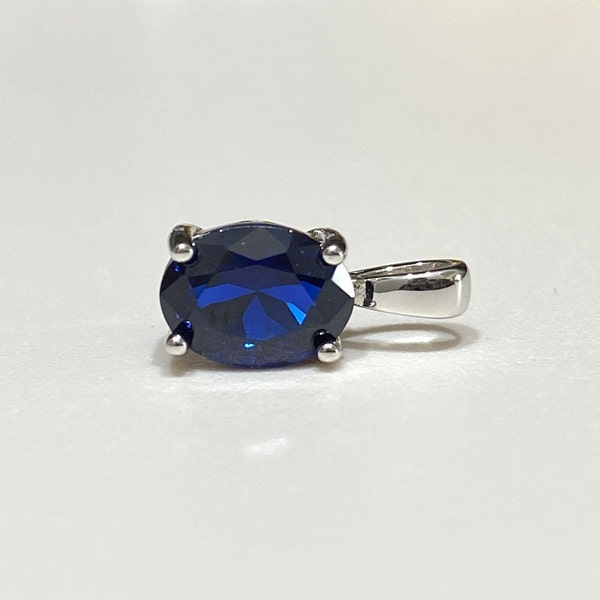 Sterling Silver Oval cut Blue Sapphire Pendant.