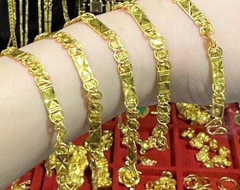 Pulsera vintage de eslabones de oro macizo 980 de 23 quilates.
