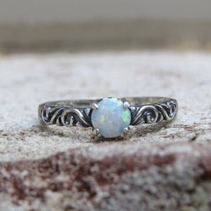 Vintage Sterling Silver White Opal carved band Ring.