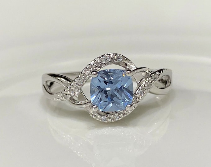 Sterling Silver Aquamarine & White Topaz Ring.