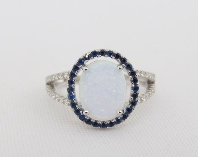 Vintage Sterling Silver White Opal, Blue Sapphire & White Topaz Halo Ring.