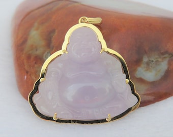 May include: A gold pendant featuring a carved lavender jade Buddha. The Buddha is sitting with its hands in its lap and has a serene expression.