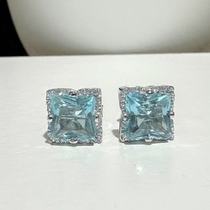 Sterling Silver Aquamarine & White Topaz Halo Earrings.