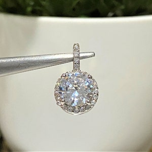 Sterling Silver Round cut White Topaz Halo Pendant.