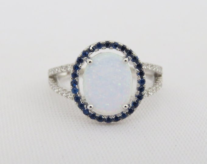 Vintage Sterling Silver White Opal, Blue Sapphire & White Topaz Halo Ring.