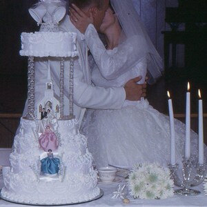 1967 Kodachrome Slide • Bride & Groom Kissing Behind Wedding Cake • Midcentury Reception • Vintage 35mm Transparency