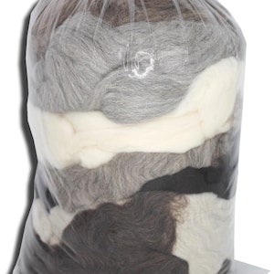 May include: A clear plastic bag filled with various shades of gray, white, and black wool roving. The wool is tightly packed, creating a layered effect. The bag is sealed at the top with a red tie.
