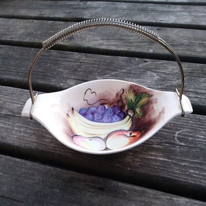 Ucagco boat style dish with metal handle