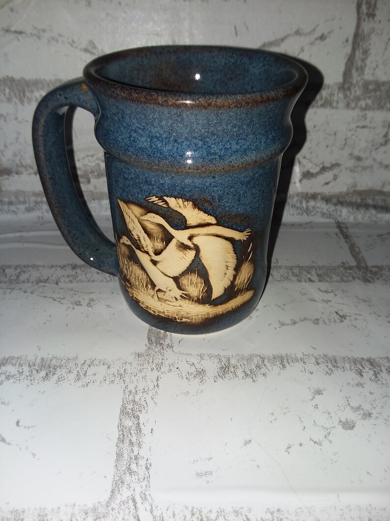 Ceramic blue mug with geese