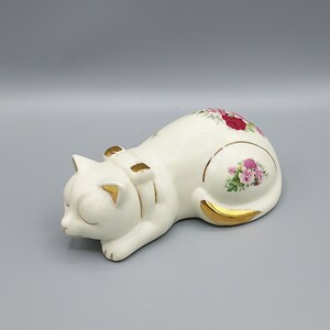 Formalities by Baum Bros laying cat figurine