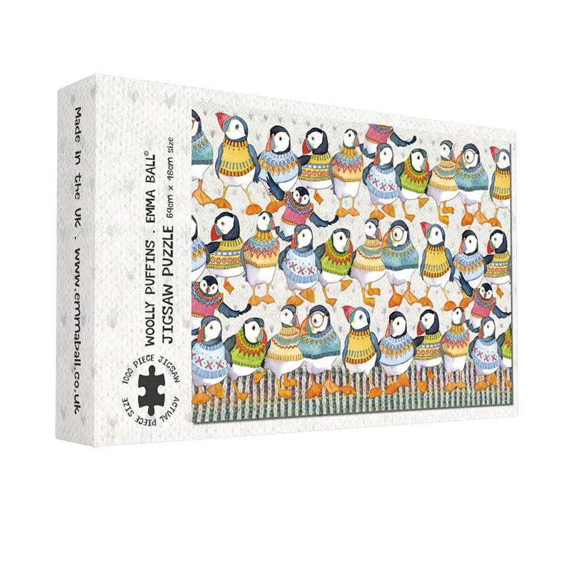 May include: A jigsaw puzzle box featuring a colorful illustration of numerous puffins wearing sweaters. The puzzle is titled "Woolly Puffins" and is 69cm x 18cm in size. The box also includes the text "1000 Piece Jigsaw Puzzle".