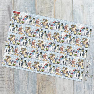 May include: A rectangular jigsaw puzzle featuring a repeating pattern of penguins wearing winter attire. The penguins are depicted in various poses, with hats, scarves, and mittens. The puzzle is on a light blue background with the text "Emma Ball" in the upper left corner.