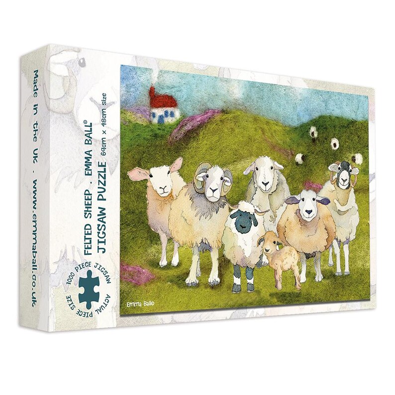 May include: A jigsaw puzzle box featuring a colorful illustration of a flock of sheep on a green hillside with a small house. The puzzle is labeled "Felted Sheep" and is 69cm x 48cm in size, with 1000 pieces. The box has the text "Made in the UK".