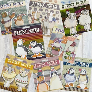 May include: A selection of illustrated sticky note pads, each displaying the text "STICKY NOTES", "60 sheets in total", and the name "Emma Balle". The pads feature animal and gnome illustrations, including bears, llamas, sheep, puffins, gnomes, cats, and penguins.