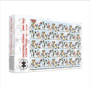 May include: A boxed 1000-piece jigsaw puzzle titled "Christmas Friends" by Emma Ball. The puzzle features a repeating pattern of penguins wearing winter clothing. The box is white with text and a penguin illustration. The puzzle size is 69cm x 18cm.