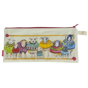 May include: A beige zippered pouch with a white background and a colourful illustration of sheep wearing jumpers. The sheep are in a line and have different coloured jumpers with various patterns. The pouch has a red zipper and a white fabric loop.