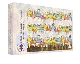 May include: A jigsaw puzzle box featuring a colorful illustration of sheep wearing sweaters. The box reads "SHEEP IN SWEATERS" and "JIGSAW PUZZLE". The puzzle size is 69cm x 48cm.