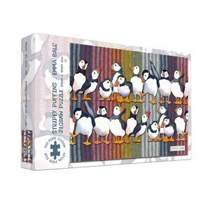 May include: A jigsaw puzzle box featuring a colorful illustration of puffins. The puzzle is titled "Stripey Puffins" and contains 1000 pieces. The box dimensions are 64cm x 48cm.