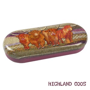 May include: A purple and brown glasses case featuring a colourful illustration of four Highland cows. The case has the text "HIGHLAND COOS" printed on the bottom.