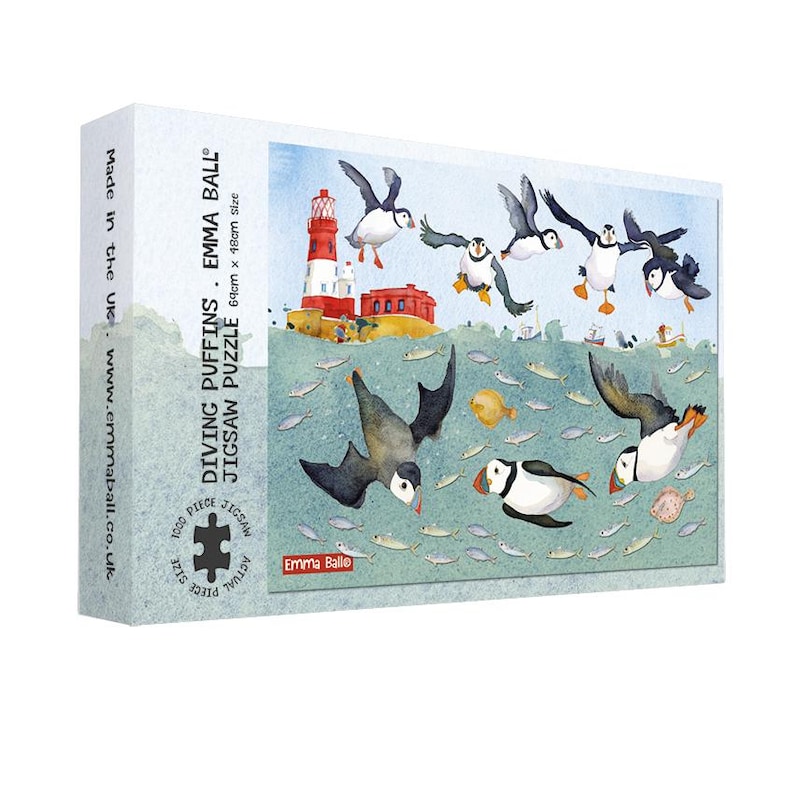 May include: A jigsaw puzzle box featuring a colorful illustration of puffins diving into the sea. The puzzle is titled "Diving Puffins" and is 64cm x 48cm in size. The box has a white background with text and a colorful image of puffins and fish.