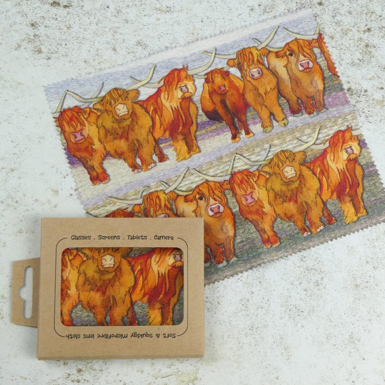 May include: A set of 8 microfiber cloths with a watercolor illustration of Highland cows. The cloths are packaged in a brown cardboard box with the text "Set of 8 Aprons & Microfibre Lens Cloth Glasses - Screens - Tablets - Camera" printed on the front.