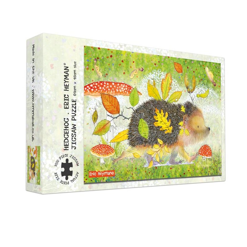 May include: A jigsaw puzzle box featuring a whimsical illustration of a hedgehog with autumn leaves and mushrooms. The box reads "HEDGEHOG - ERIC HEYMAN JIGSAW PUZZLE" and indicates a 69cm x 48cm size. The puzzle contains 1000 pieces.